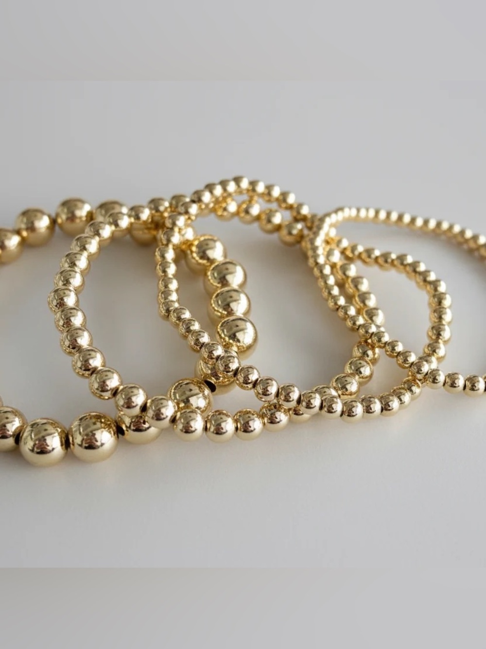 16 Pieces of Plunder Gold Beaded Stretch Bracelets